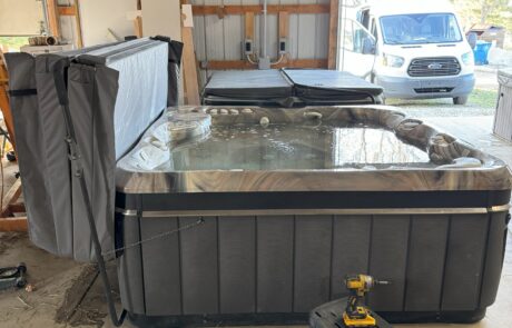 Testing refurbished hot tub in Johnnie Stewart's workshop